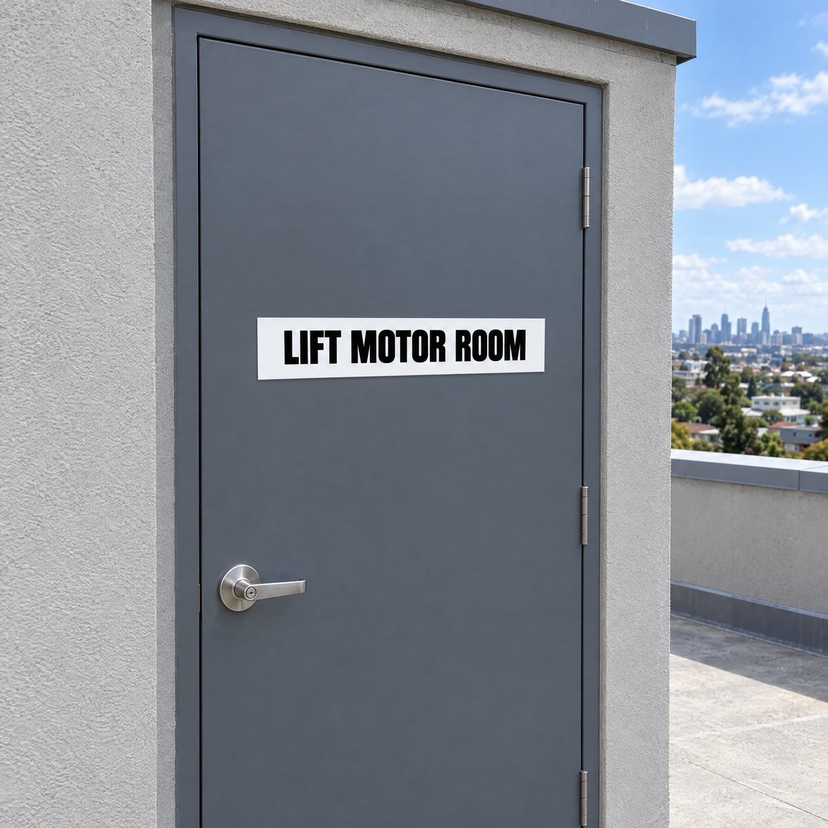 White and black Lift Motor Room sign on a lift motor room door on an Australian rooftop