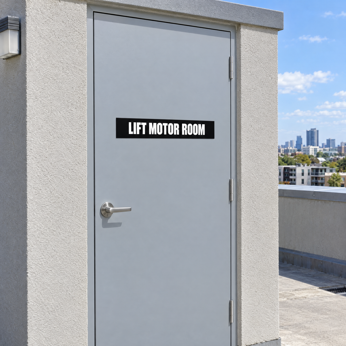 Black and white Lift Motor Room sign on a lift motor room door on an Australian rooftop