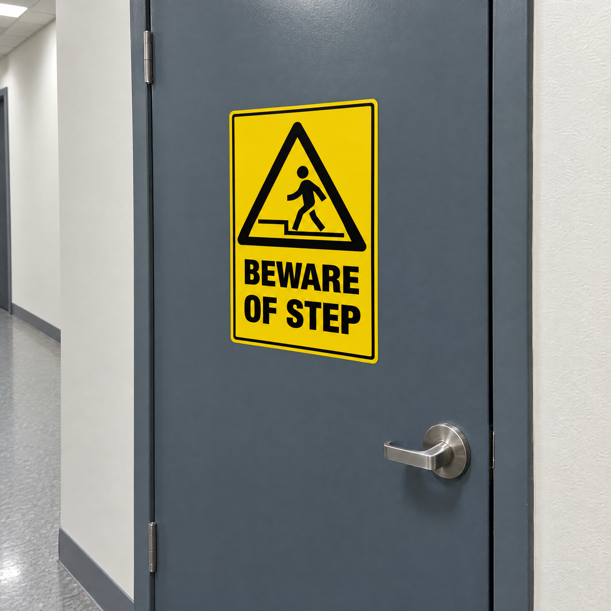 Warning Beware of Step Sign installed on a corridor door