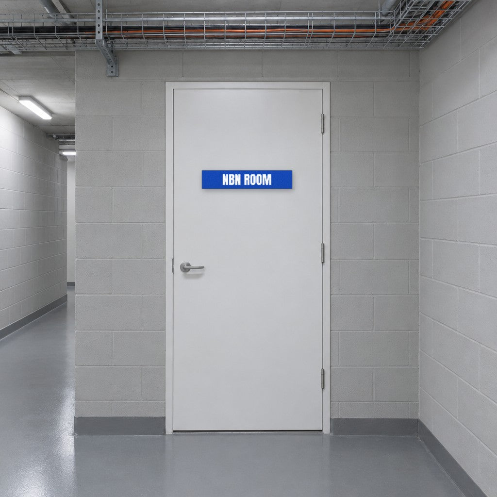 Blue and white NBN Room sign on an NBN room door in an Australian apartment building basement
