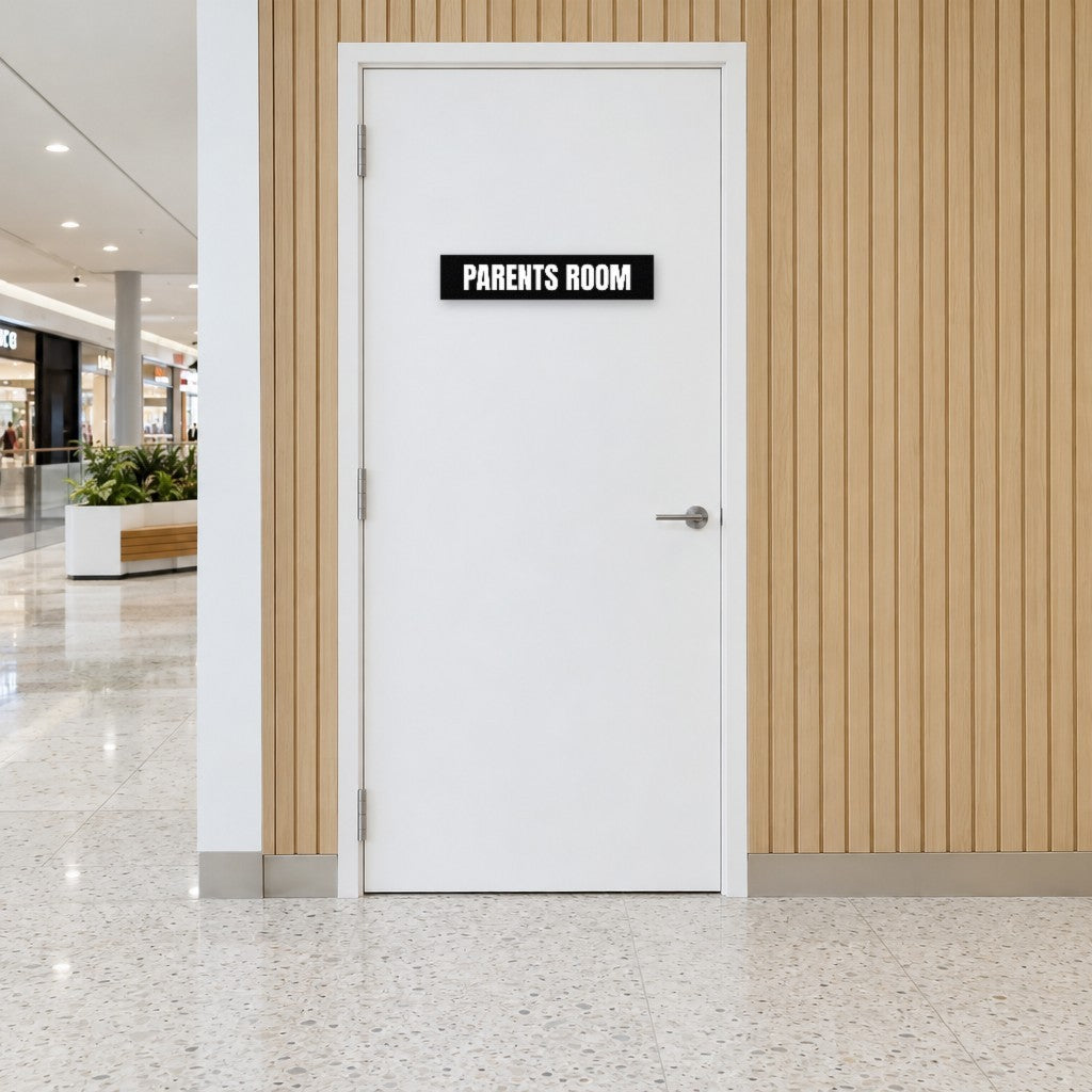 Black and white Parents Room sign on a parents room door in an Australian shopping centre