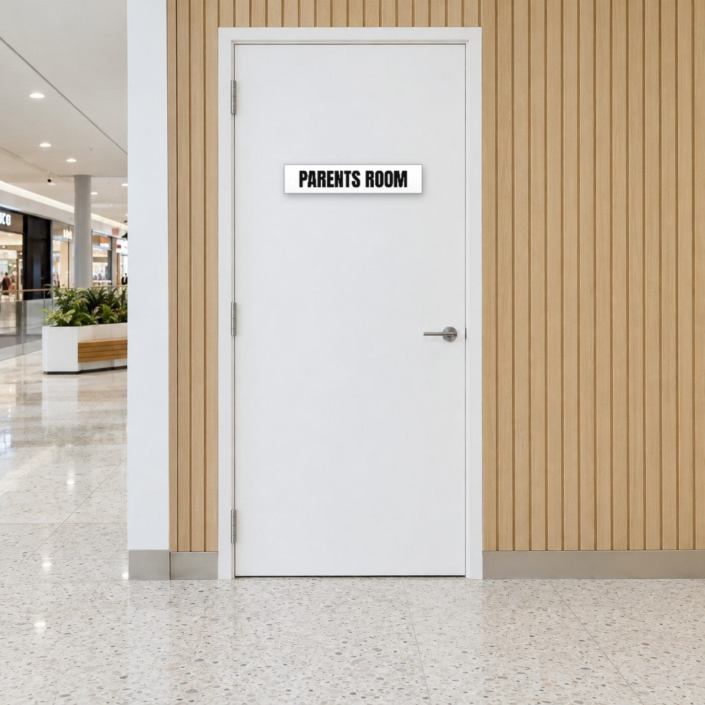 White and black Parents Room sign on a parents room door in an Australian shopping centre