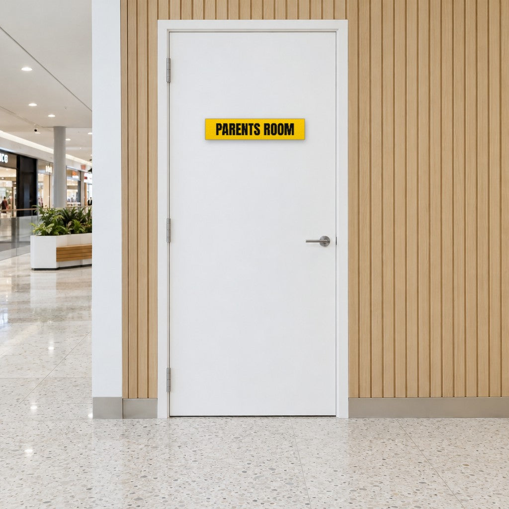 Yellow and black Parents Room sign on a parents room door in an Australian shopping centre