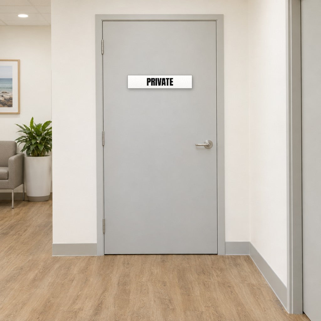 White and black Private sign on a private door in an Australian medical clinic